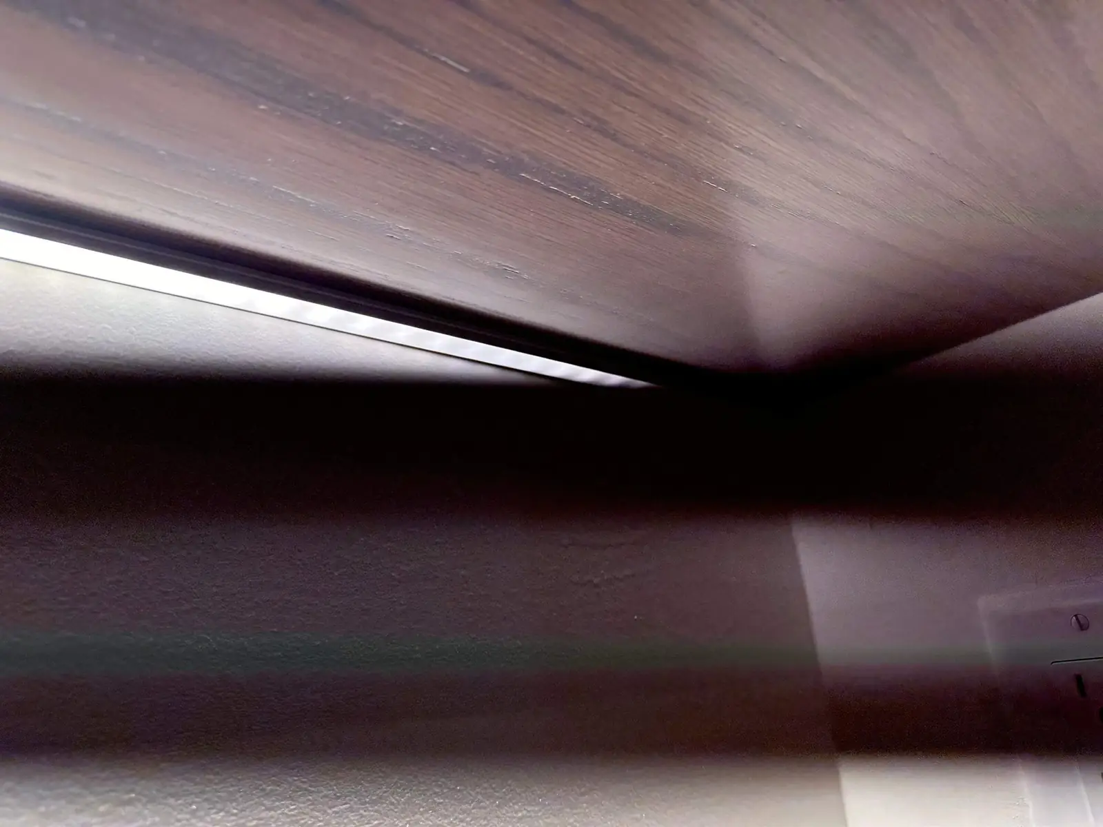 Ceiling cove lighting washing a wood-plank ceiling