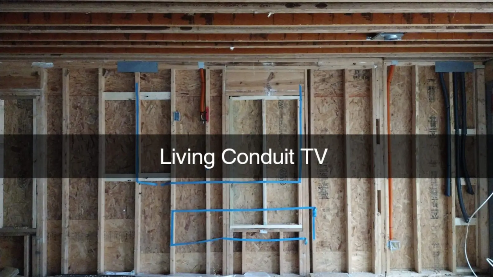 Labeled TV conduit prewire in an open wall