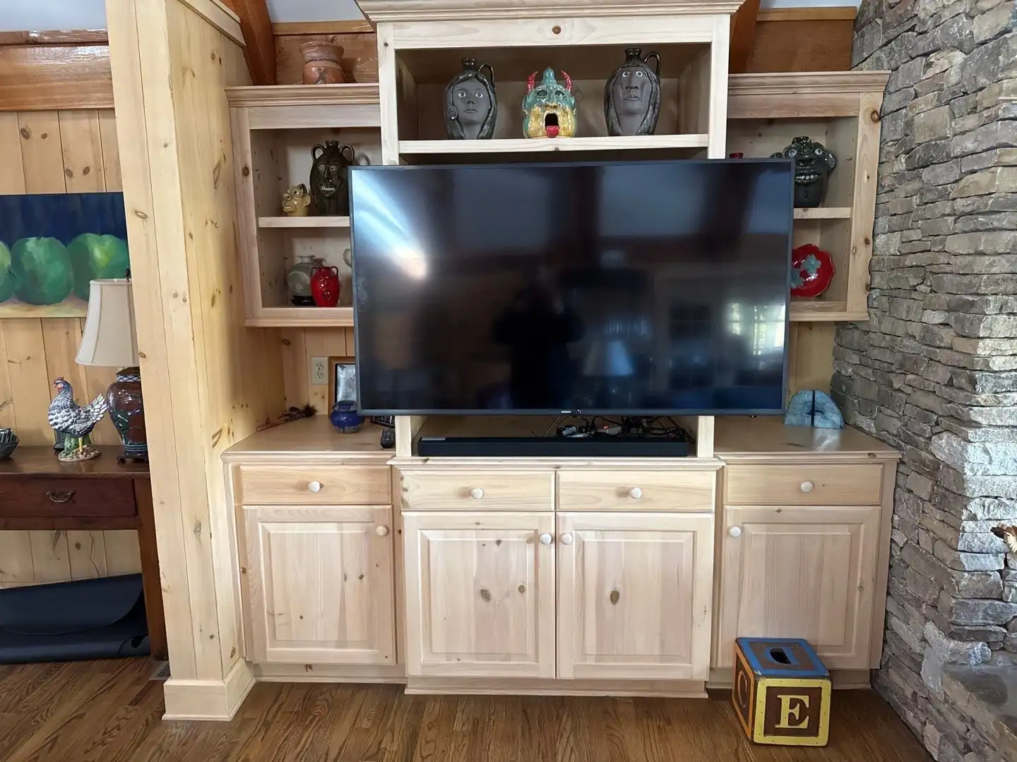 Flat-screen TV set into custom wood built-ins