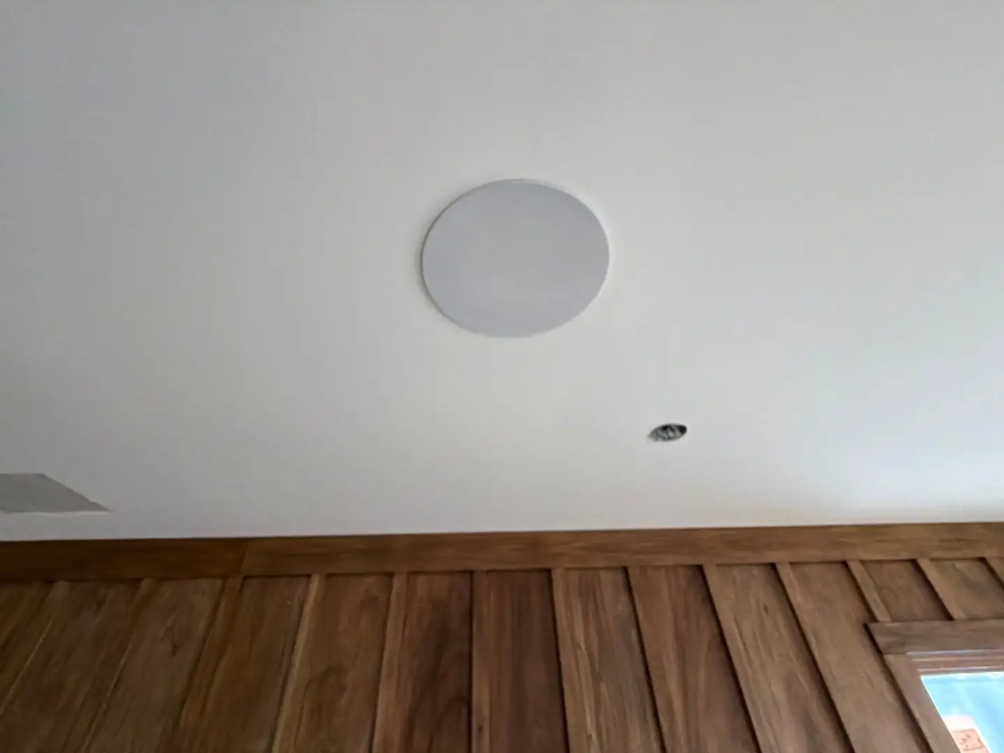 Flush in-ceiling speaker in a finished sitting room