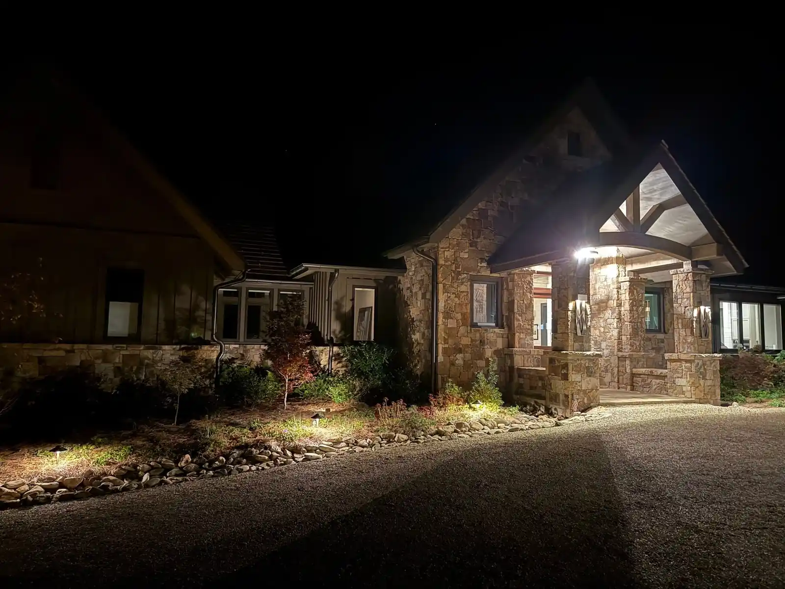 Illuminated front entry and plantings at night