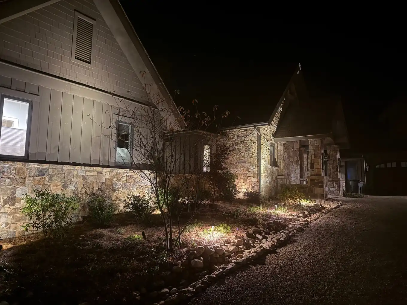 Stone facade washed with warm uplighting at night