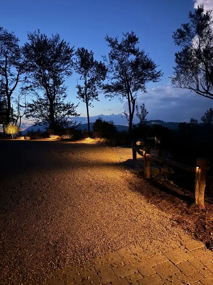 Path lighting along a drive with Blue Ridge views at dusk